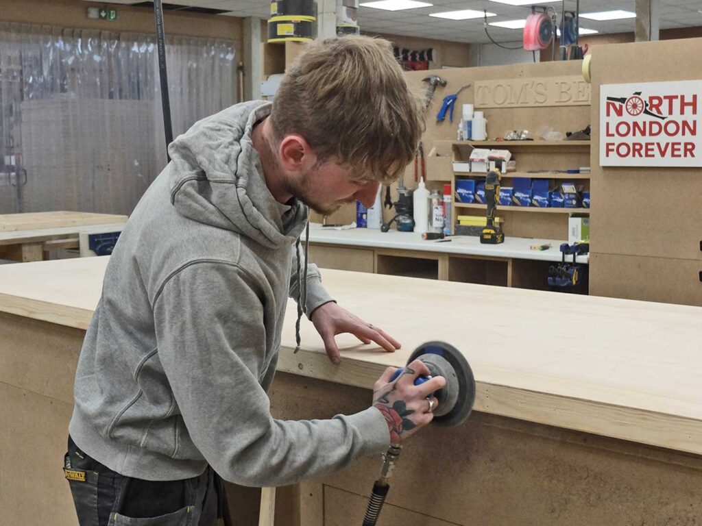 Sanding the edge with an orbital sander